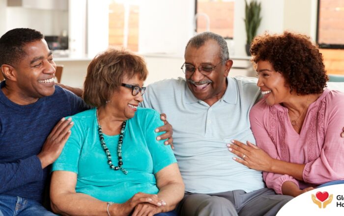 A couple sits with aging parents and enjoys their time together.